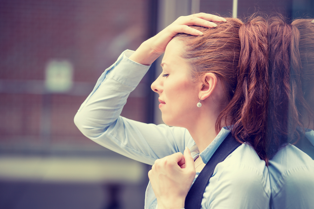 portrait stressed sad young woman outdoors