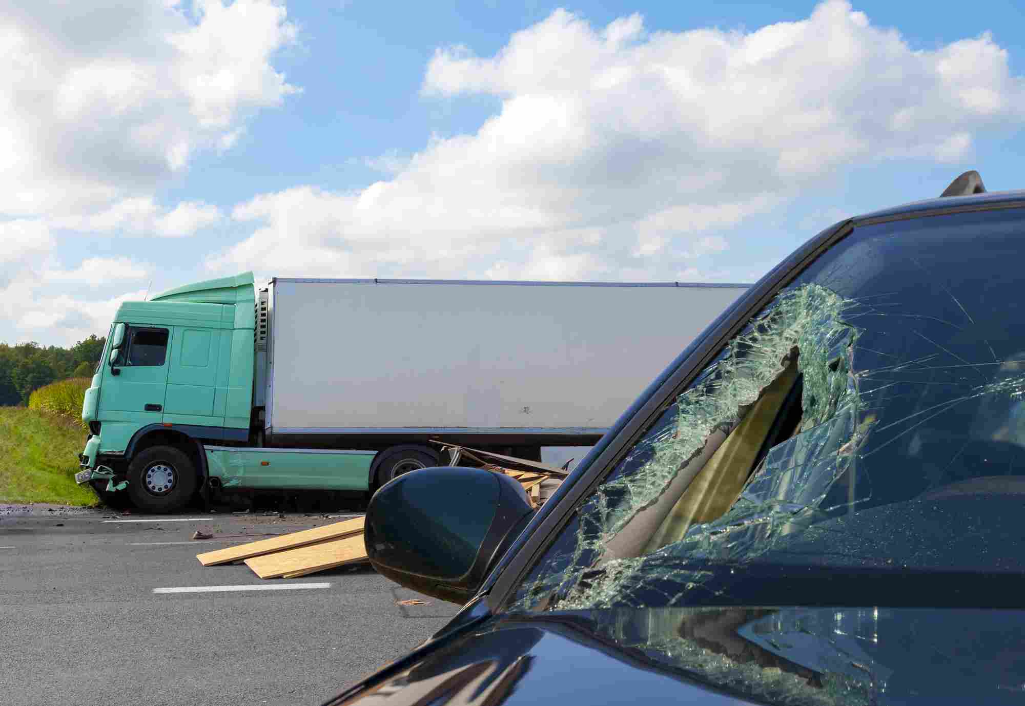 california truck accident attorney - View of truck in an accident with car, cloudy sky