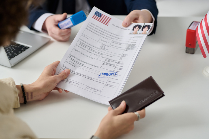 Woman receiving immigration documents - can an undocumented immigrant make a personal injury claim?