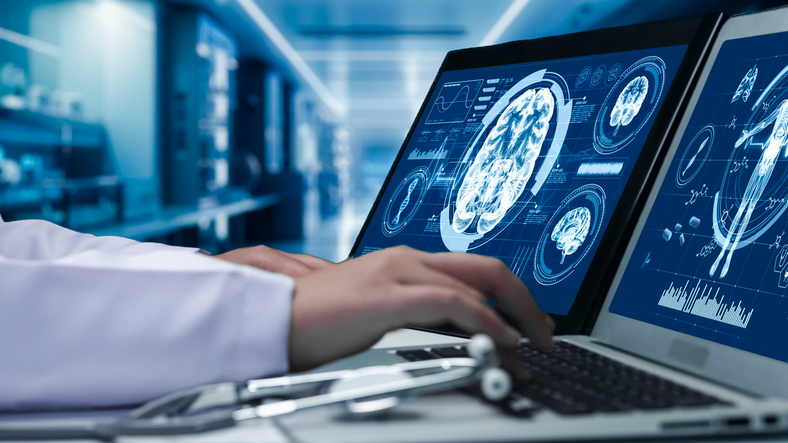 doctor analyzing a brain scan - can a brain injury show up years later?